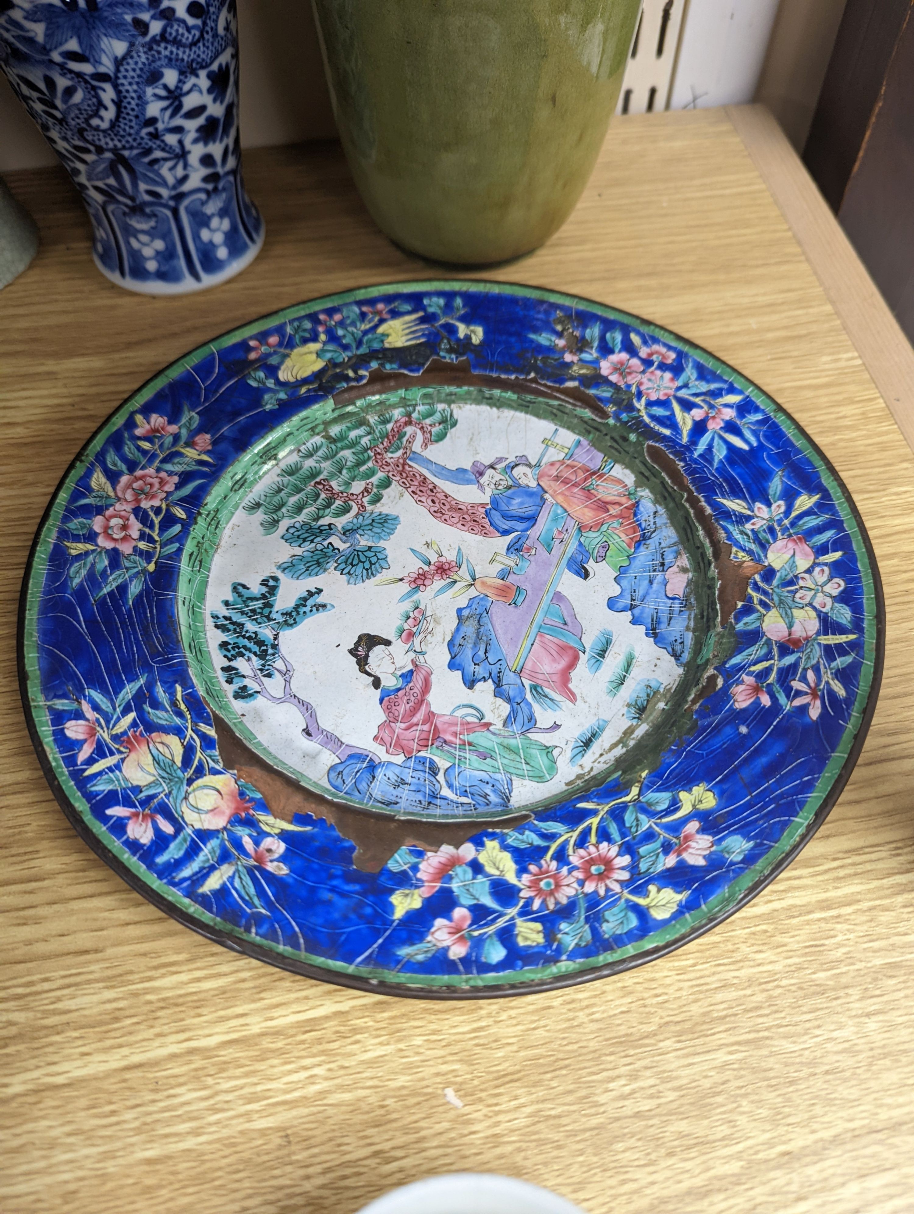 A Chinese Canton enamel dish, 22.5cm, a Chinese famille rose salt cellar, Qing dynasty, two Chinese blue and white vases and a slender crackle glaze vase, Qing and later, 30cm, assorted Chinese ceramics, a lacquered comp